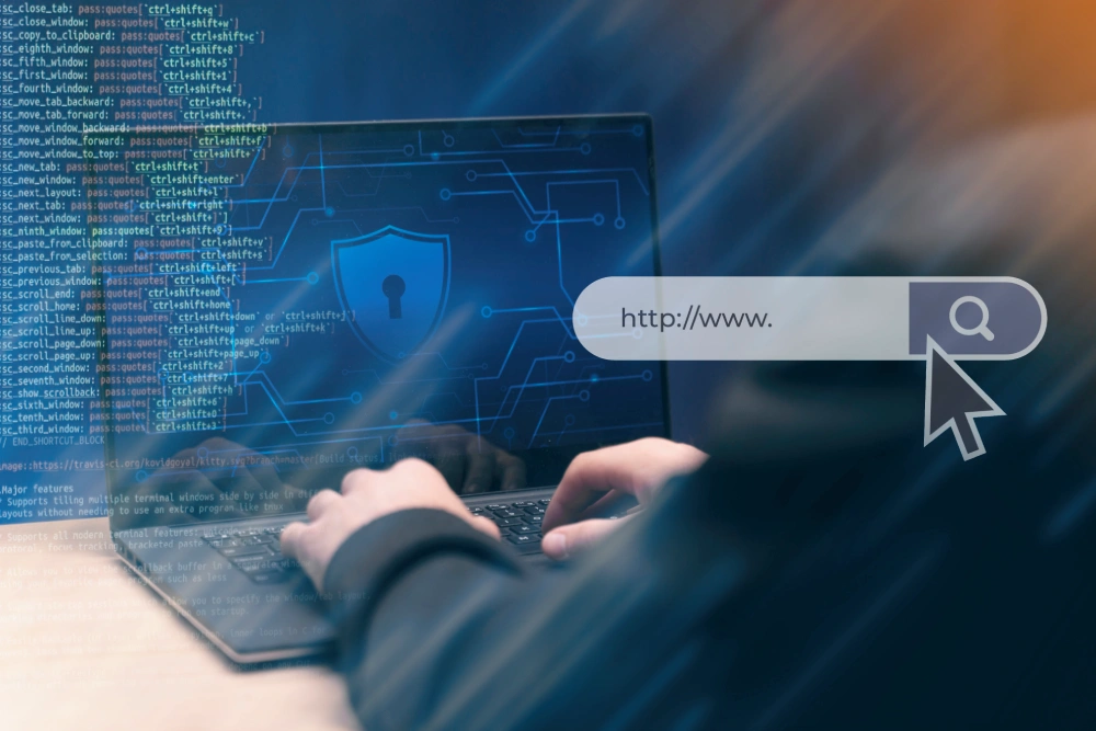 Person typing on laptop with digital security graphics