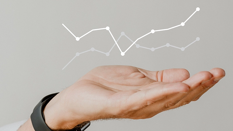 Hand holding a virtual growth chart