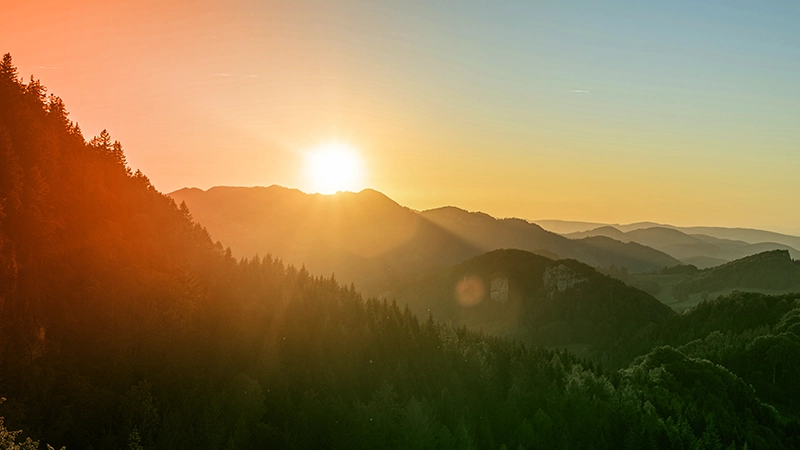 Sunrise over green mountains